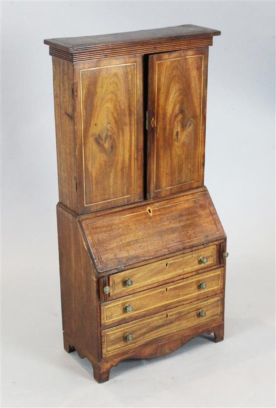 An antique model of a George III mahogany bureau bookcase, W.1ft 5in. D.9in. H.3ft